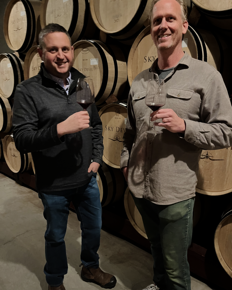jeff goldberg and matt vogt in a wine barrel room
